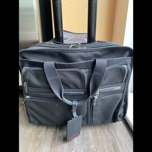 Tumi deluxe laptop brief travel bag with 4 wheels
